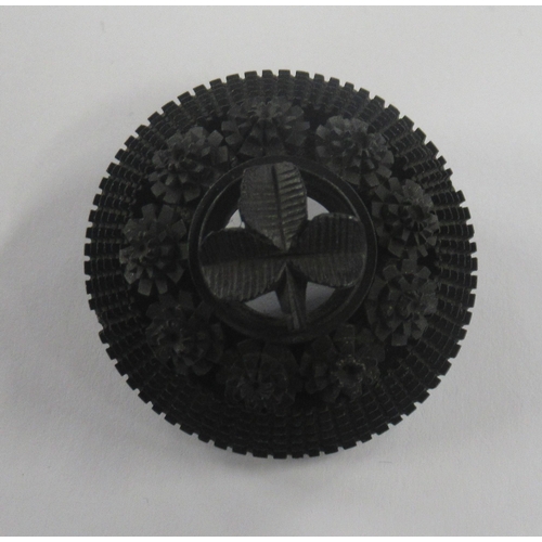 226 - A Victorian jet mourning brooch, of circular form