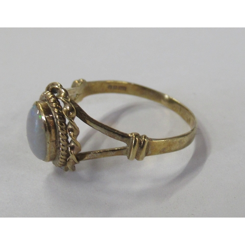 228 - A 9ct gold ring, set with an opal, weight 1.7g