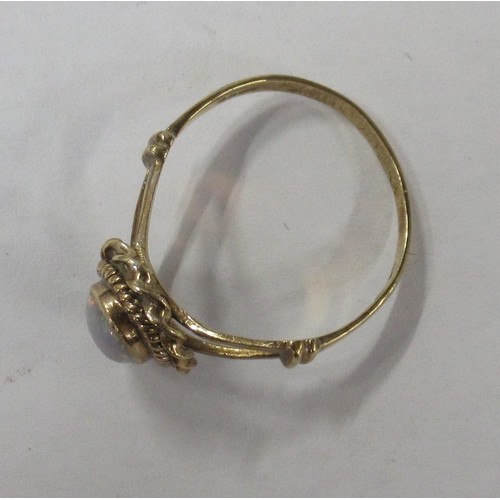 228 - A 9ct gold ring, set with an opal, weight 1.7g