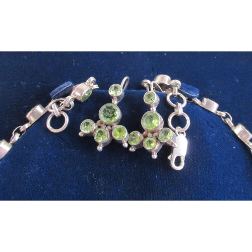 231 - A jewellery suite, comprising necklace, bracelet and earrings, all set with green stones in silver, ... 
