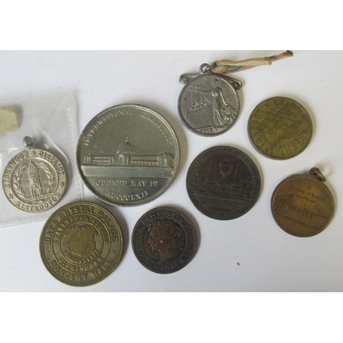 242 - A collection of medals and tokens, to include the International Exhibition, Kingswood & District med... 