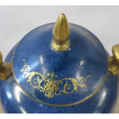 256 - A Royal Worcester covered pedestal vase, decorated with a circular reserve of fruit by Moseley, to a... 