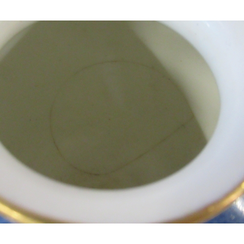 256 - A Royal Worcester covered pedestal vase, decorated with a circular reserve of fruit by Moseley, to a... 