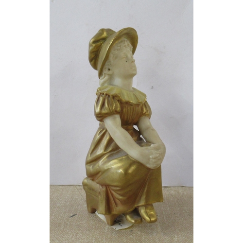 257 - A Royal Worcester gilded ivory Kate Greenaway figure, of a seated girl, model number 901, height 4in... 