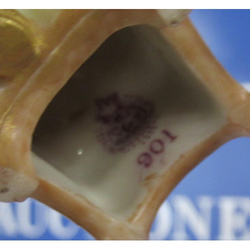 257 - A Royal Worcester gilded ivory Kate Greenaway figure, of a seated girl, model number 901, height 4in... 