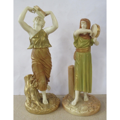 259 - Two Royal Worcester shot silk figures, both of woman playing tambourines, model number 2016 and 1084... 
