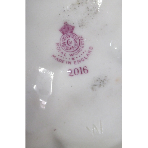 259 - Two Royal Worcester shot silk figures, both of woman playing tambourines, model number 2016 and 1084... 