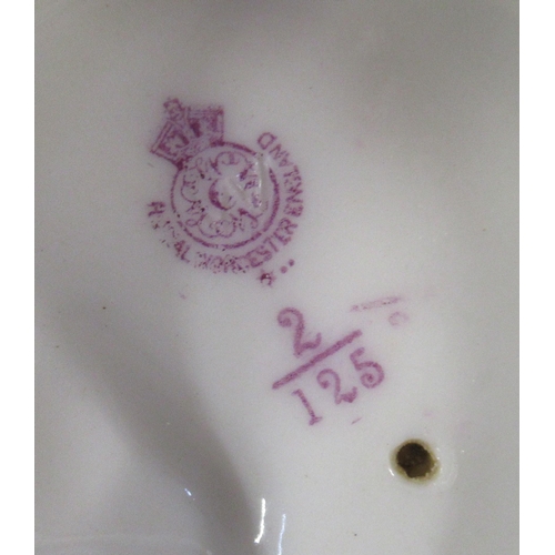 263 - A Royal Worcester shot silt figure, of a water carrier, model number 125, height 10ins, together wit... 