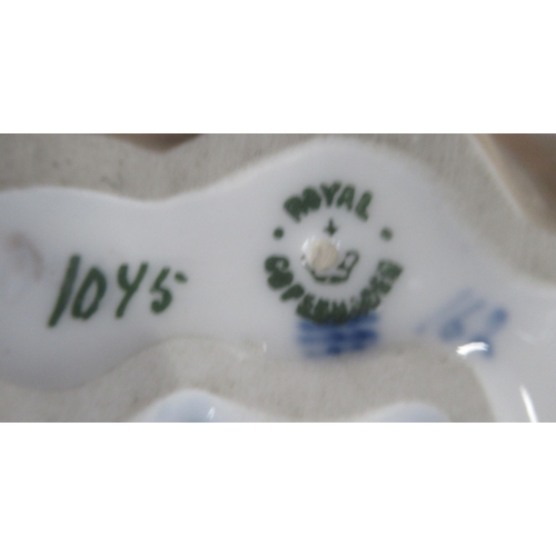 264 - A Royal Copenhagen model, of three birds, No 1045  made before 1927, together with a frog on a dish ... 