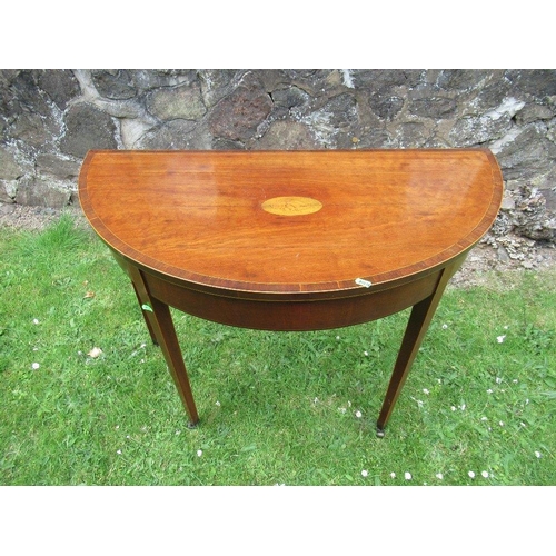 30 - A 19th century mahogany  half round cross banded fold over games table width 38ins,