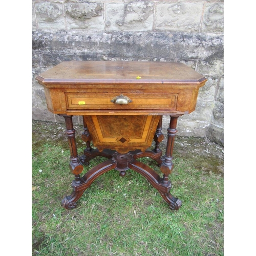 41 - A Victorian walnut games table, with swivel games top, over pull out drawer, raised on turned legs, ... 