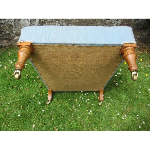 43 - An Howard style arm chair raised on turned wooden legs