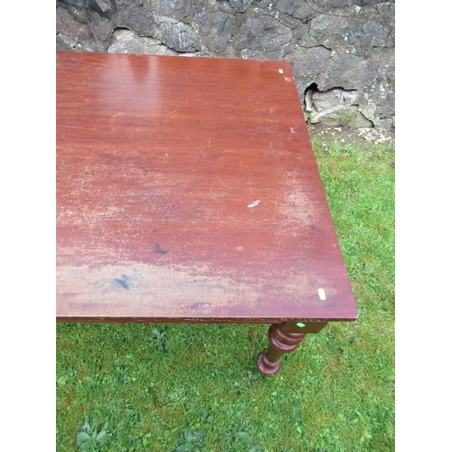 52 - A 19th mahogany dining/kitchen table, raised on turned legs, 60ins x 42ins, height 30ins