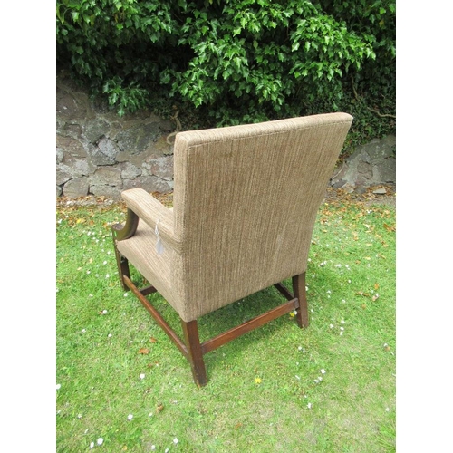 55 - A Georgian style armchair with acanthus carving to an open arm with blind fret carving to the legs