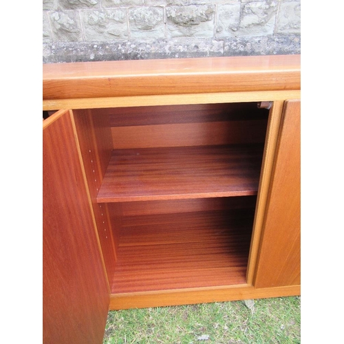 62 - A Danish Skovby sideboard, fitted with four cupboard doors, opening to reveal shelves and drawers, w... 