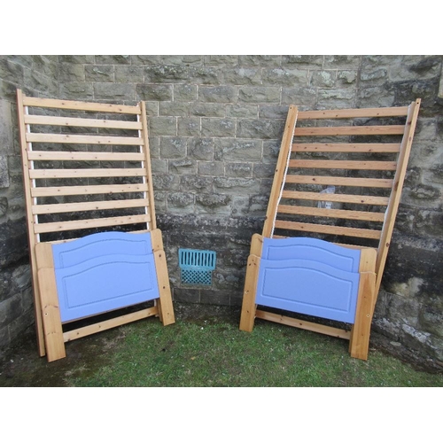 65A - A pair of painted pine single bed frames