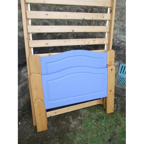 65A - A pair of painted pine single bed frames