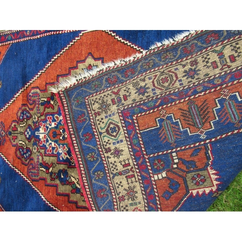 73 - An Eastern rug with a blue field having central design and stylized decoration 69ins x 47ins