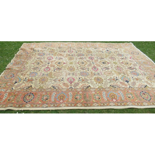 74 - A large rug, with floral scroll decoration, 110ins x 148ins