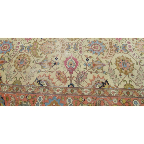 74 - A large rug, with floral scroll decoration, 110ins x 148ins