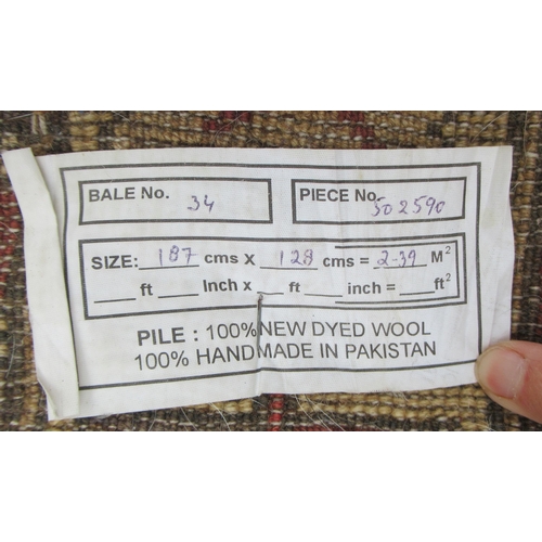 75 - A Pakistan rug, in browns, 51ins x 74in
