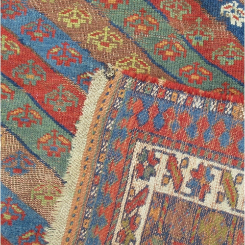 78 - An Eastern design rug, with stripe field, 104ins x 48ins