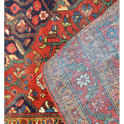 79 - A rug, decorated in blue and red, 78ins x 50ins