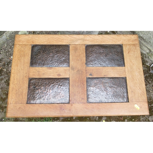 84 - An Arts and Crafts style oak coffer, set with beaten copper panels, 25ins x 16.5ins, height 17.5ins