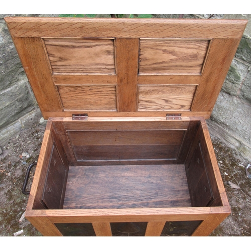 84 - An Arts and Crafts style oak coffer, set with beaten copper panels, 25ins x 16.5ins, height 17.5ins