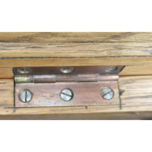 84 - An Arts and Crafts style oak coffer, set with beaten copper panels, 25ins x 16.5ins, height 17.5ins