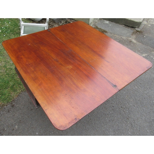 88 - A Victorian fold over tea table, raised on carved legs