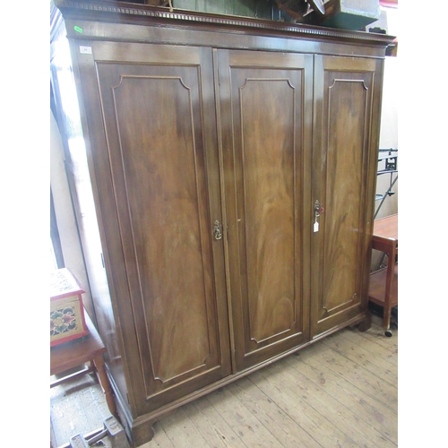 92 - A triple door wardrobe, 73ins x 71ins