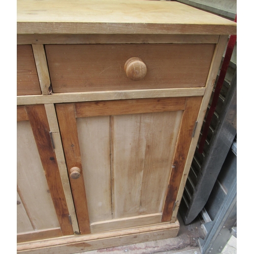 95 - A pine sideboard, fitted with drawers over cupboards
