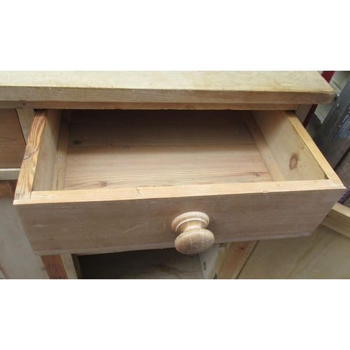 95 - A pine sideboard, fitted with drawers over cupboards