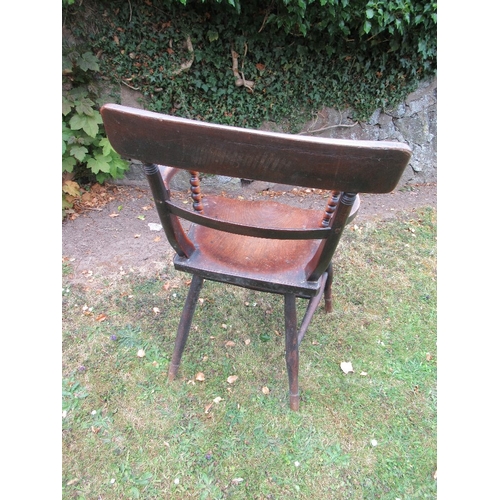 19b - A 19th century oak open arm chair