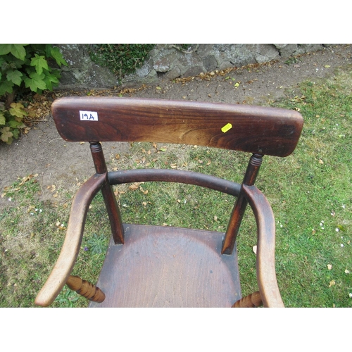 19b - A 19th century oak open arm chair