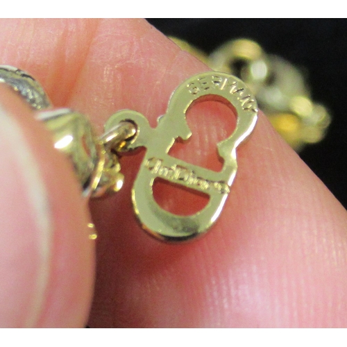 243A - Two Dior necklaces, together with others, in display cases