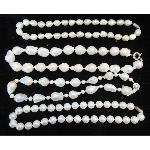 243A - Two Dior necklaces, together with others, in display cases