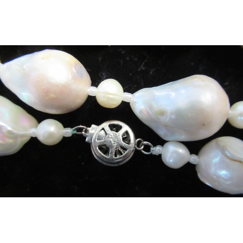 243A - Two Dior necklaces, together with others, in display cases