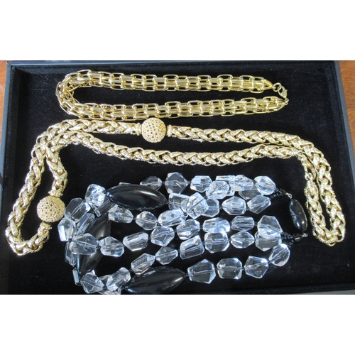 243A - Two Dior necklaces, together with others, in display cases