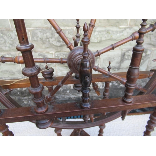 10 - (43) A small antique spinning wheel with bobbin turned supports raised on a triangular base, height ... 