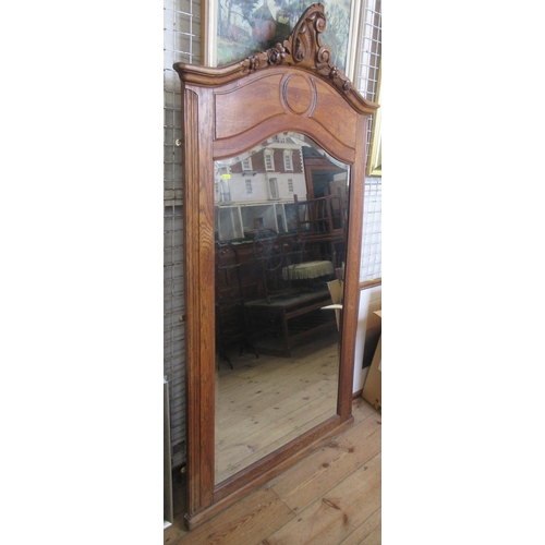 177 - A large wooden framed wall mirror, with carved decoration, overall 66ins x 36ins