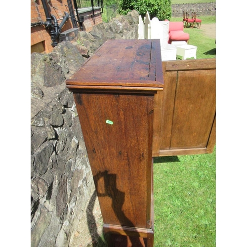 18 - (56) An antique oak cupboard with panel door to reveal two shelves and raised on a stand , width 26i... 