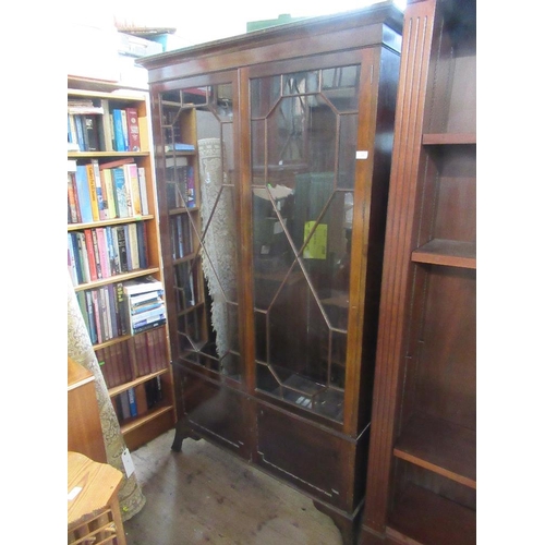 27 - A mahogany glazed cabinet, with astragal glazed doors, opening to reveal adjustable shelves, over tw... 