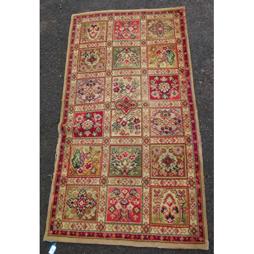 31 - A modern rug, decorated with floral squares, 58ins x 32ins