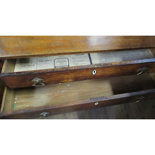 32 - A Georgian oak bureau, the sloping fall front fitted with drawers and pigeon holes, with long drawer... 