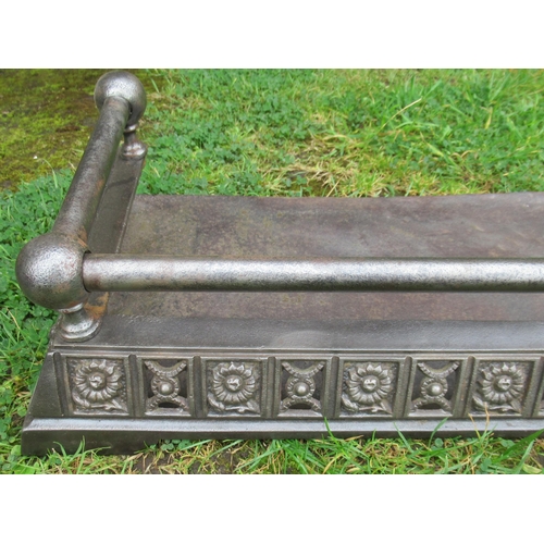 46 - A 19th century Aesthetic movement steel fire side fender, with floral and pierced decoration, width ... 