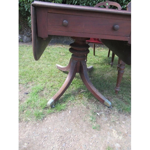 47 - A Victorian mahogany Pembroke table, fitted with a frieze drawer raised on four out splayed legs wit... 