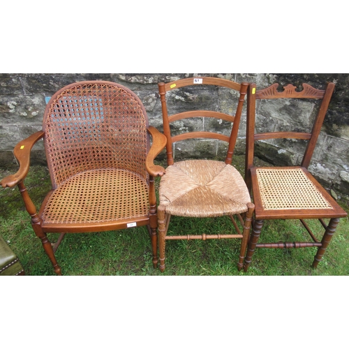 51 - Three cane chairs and a leather topped stool