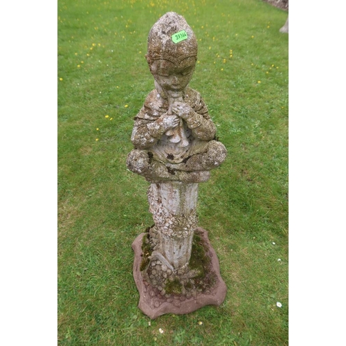 53 - A garden stone model, of an Eastern figure playing pan pipes on a column the column decorated with f... 